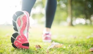 Close up picture of pink sole from running shoe in a park on a sunny day-1