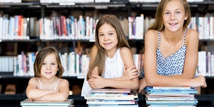 Little girls reading books in library 2.jpg