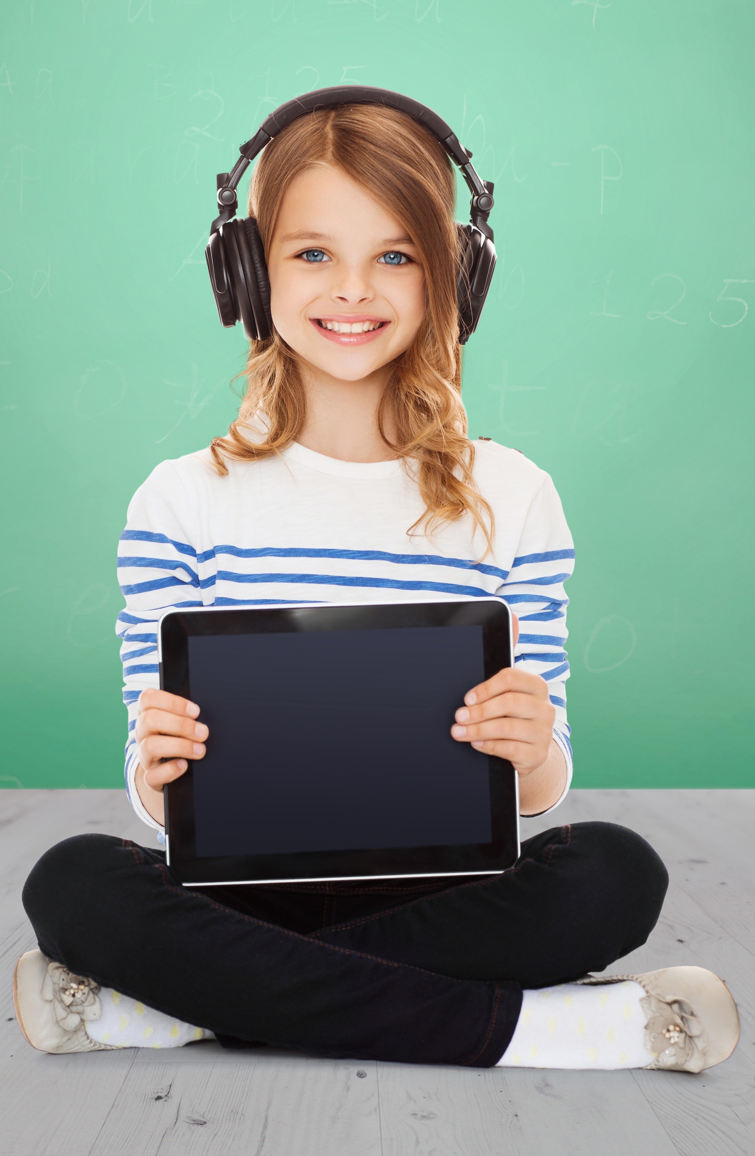 iStock-843574122girl laptop headphones-1
