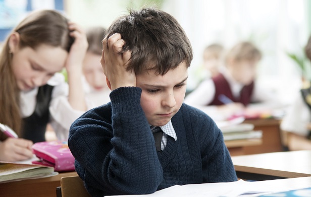boy_stressed reading classroom school boy_stressed reading classroom school